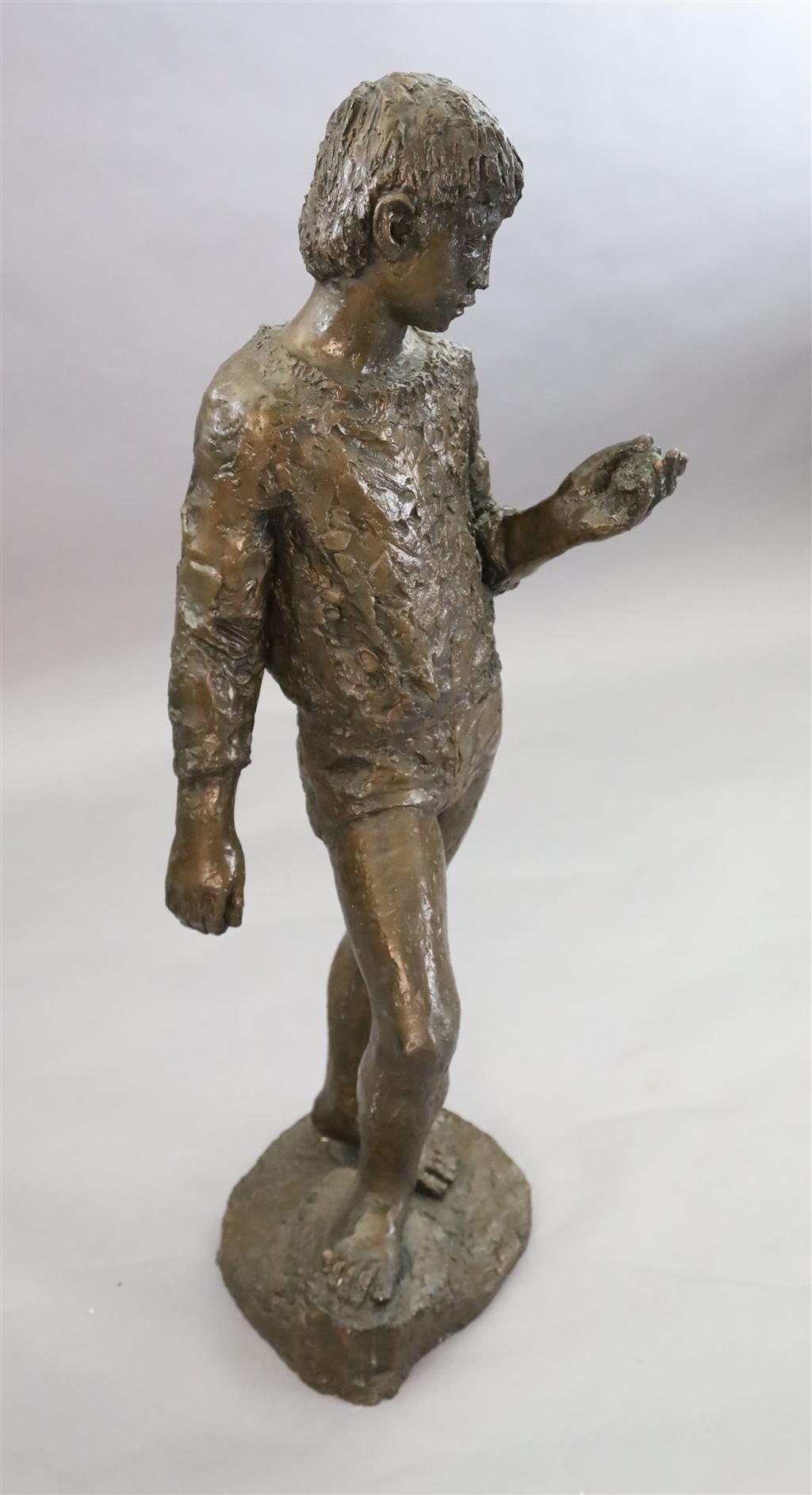 § Karin Jonzen (1914-1998). A bronze figure of a standing boy holding an ammonite shell, height 44in.